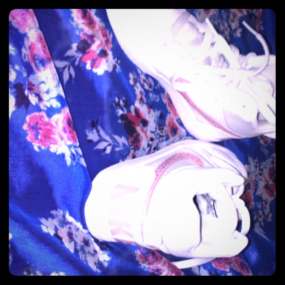 Nice pink and white Nike’s basketball shoes